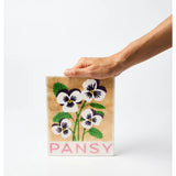 Jones & Co market wall art featuring a vibrant pansy flower with detailed botanical illustration on a neutral background.