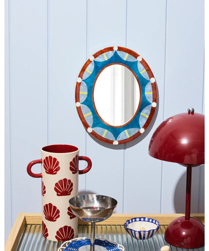 Jones & Co Paloma Mirror hanging on wall with a sleek, modern frame, reflecting a bright, stylish interior.