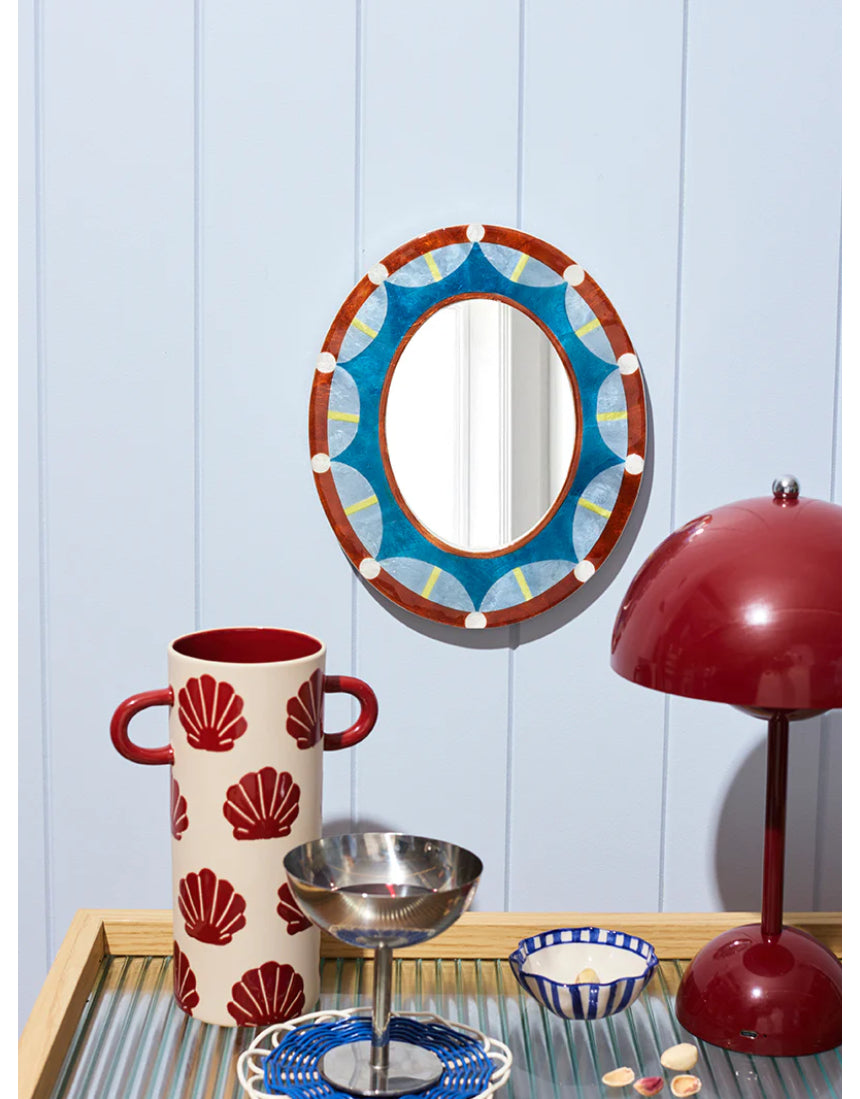 Jones & Co Paloma Mirror hanging on wall with a sleek, modern frame, reflecting a bright, stylish interior.