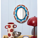 Jones & Co Paloma Mirror hanging on wall with a sleek, modern frame, reflecting a bright, stylish interior.