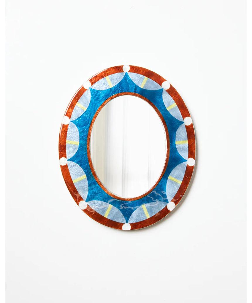 Jones & Co Paloma Mirror showing a sleek, modern design with a round shape and reflective glass surface.