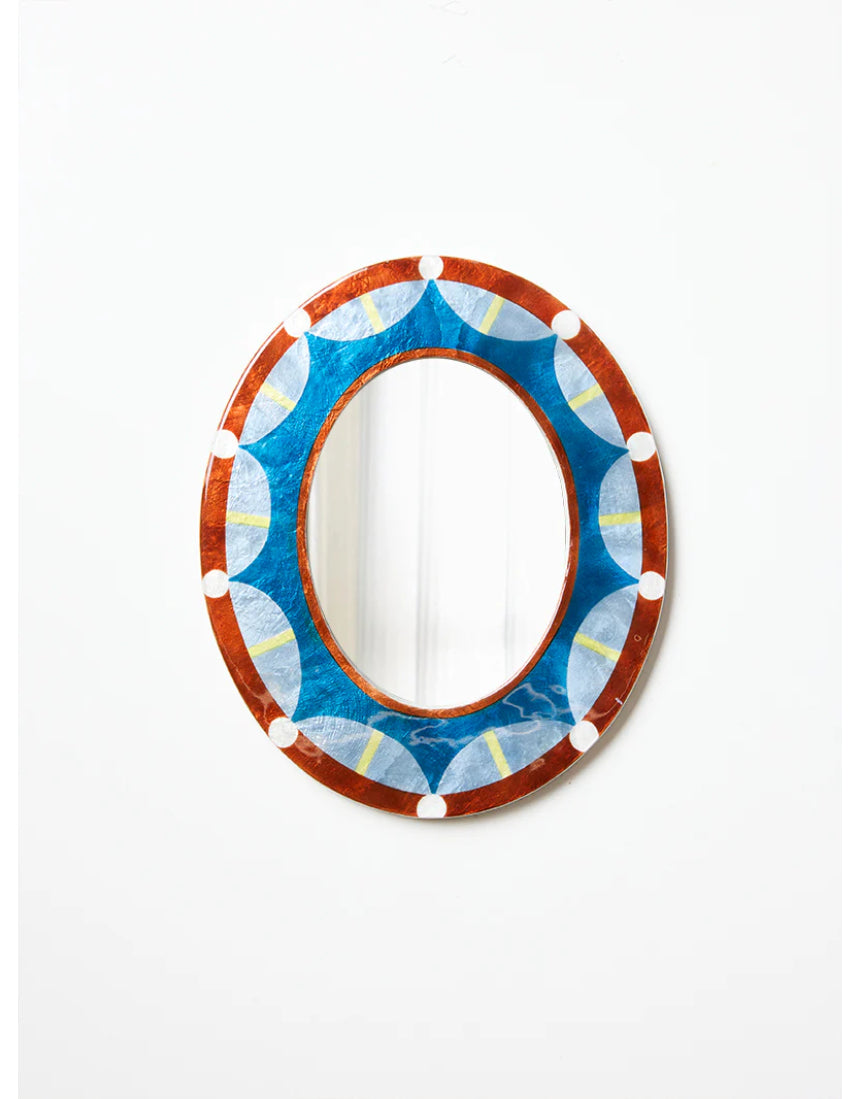 Jones & Co Paloma Mirror showing a sleek, modern design with a round shape and reflective glass surface.