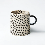 Jones & Co Chino Espresso Cup with black spot design, ceramic mug perfect for espresso or small coffee servings.