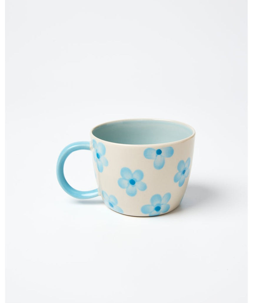 Jones & Co Chino Mug in Daisy Blue with floral pattern, ceramic mug featuring a curved handle and vibrant blue design.