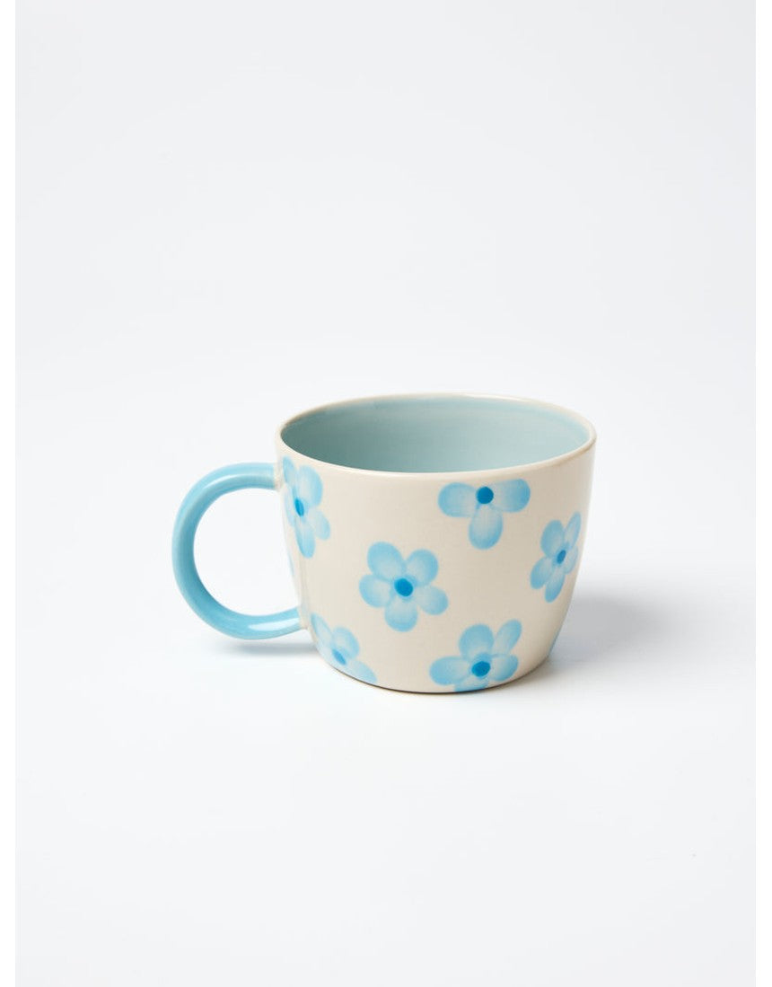 Jones & Co Chino Mug in Daisy Blue with floral pattern, ceramic mug featuring a curved handle and vibrant blue design.