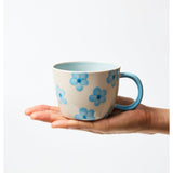 Jones & Co Chino Mug in Daisy Blue with floral pattern, ceramic mug featuring a curved handle and glossy finish.