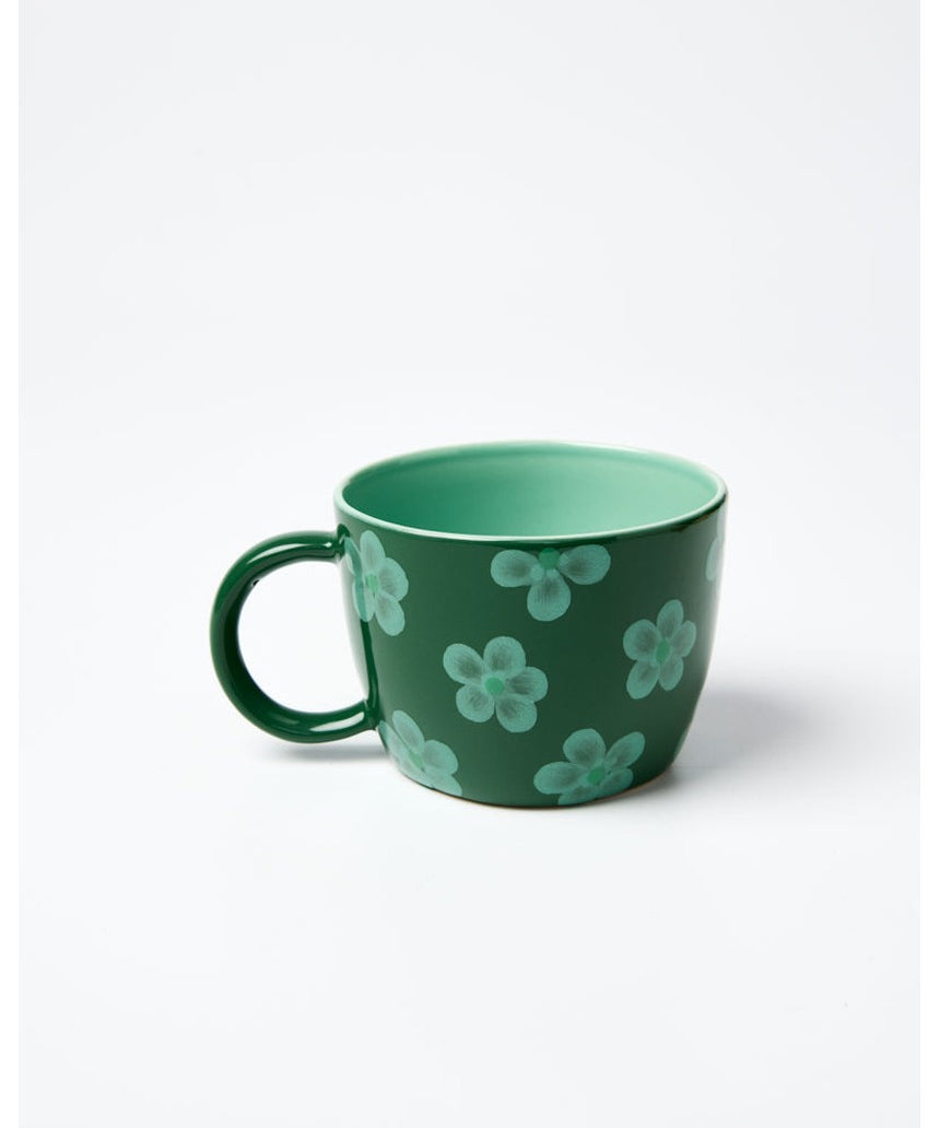 Jones & Co Daisy Green Chino Mug with floral pattern, ceramic cup featuring green and white design.