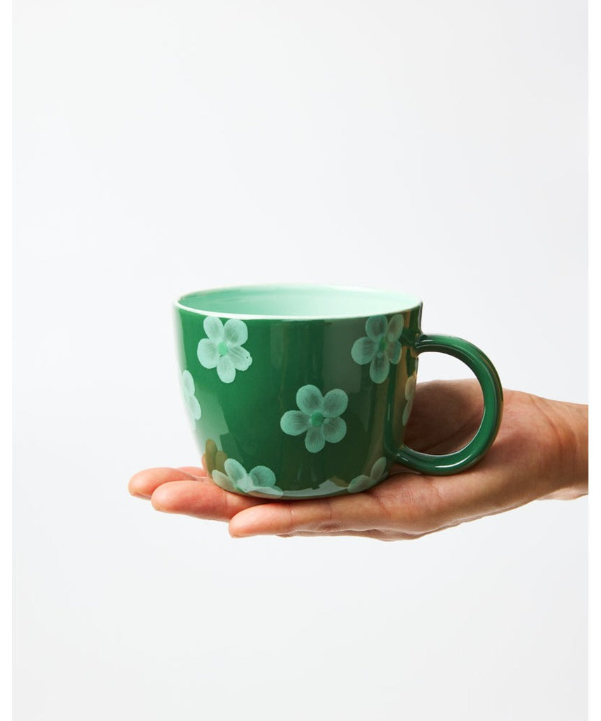 Jones & Co Chino Mug in Daisy Green with floral pattern, ceramic mug for hot beverages.