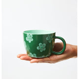 Jones & Co Chino Mug in Daisy Green with floral pattern, ceramic mug for hot beverages.