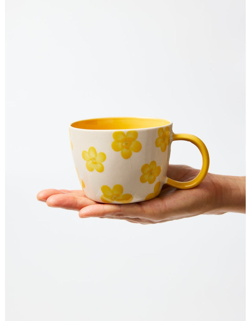 Jones & Co Chino Mug featuring a Daisy Mustard floral design, with a smooth ceramic finish and comfortable handle.