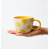 Jones & Co Chino Mug featuring a Daisy Mustard floral design, with a smooth ceramic finish and comfortable handle.