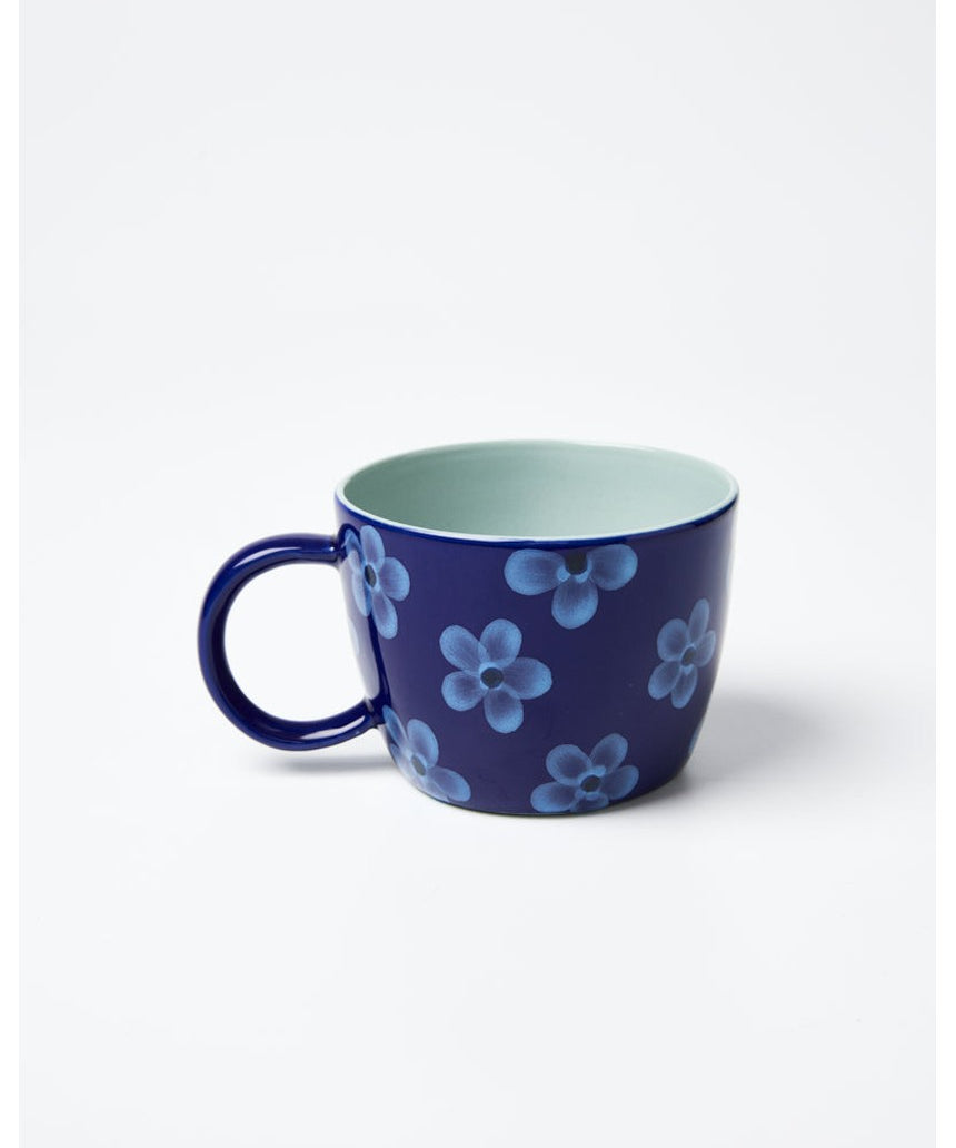 Jones & Co Chino Mug in Daisy Navy featuring a floral design on a ceramic mug with a navy background.