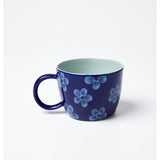 Jones & Co Chino Mug in Daisy Navy featuring a floral design on a ceramic mug with a navy background.
