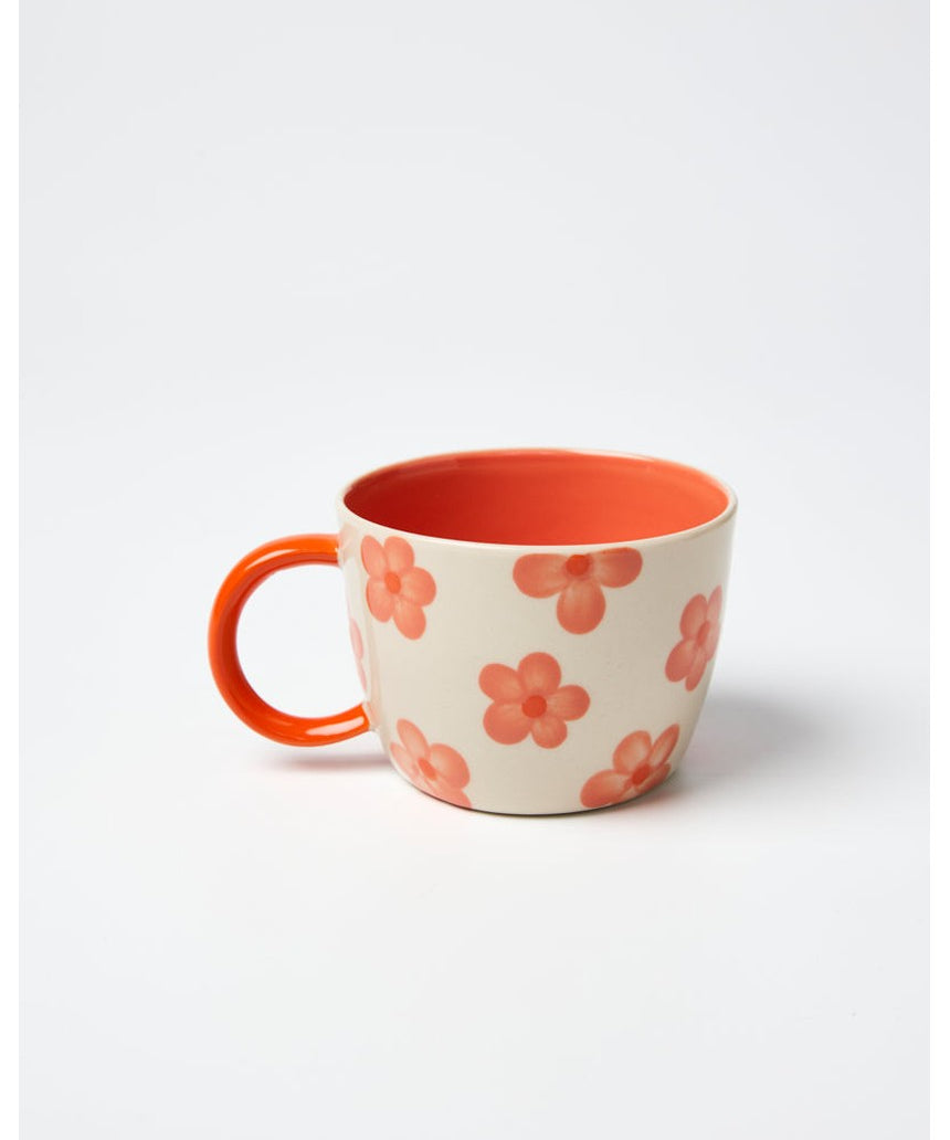 Jones & Co Daisy Peach Chino Mug with floral design and pastel pink color, ceramic coffee mug for hot beverages.