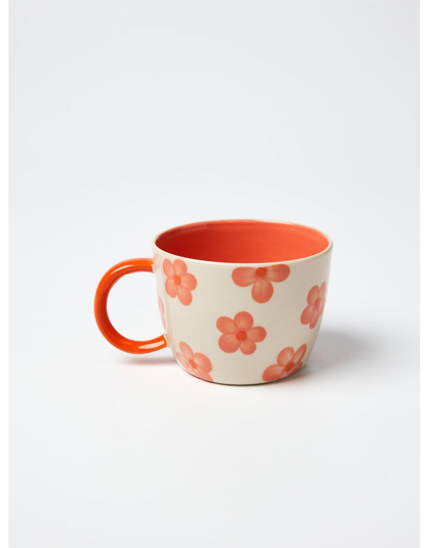 Jones & Co Daisy Peach Chino Mug with floral design and pastel pink color, ceramic coffee mug for hot beverages.