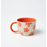 Jones & Co Daisy Peach Chino Mug with floral design and pastel pink color, ceramic coffee mug for hot beverages.
