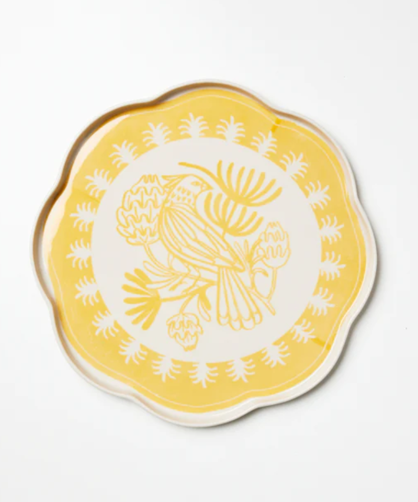 Jones & Co Del Sol bird-shaped ceramic platter in mustard yellow, featuring a detailed bird design.