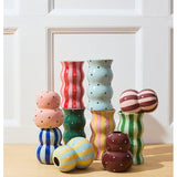 Jones & Co Fonda Vase in pink and green dotty pattern, showcasing a stylish ceramic design with a rounded shape.