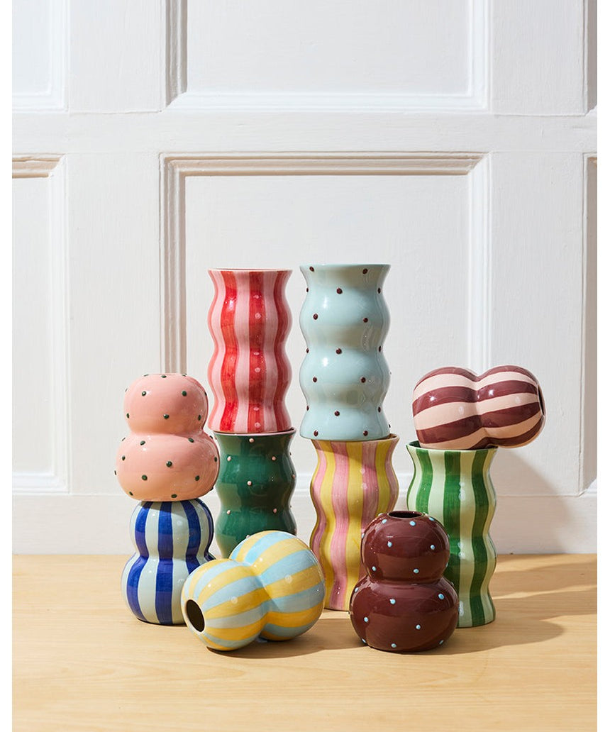 Jones & Co Palma Vase in blue and brown dotty design, showcasing a stylish ceramic vase with a rounded shape and dotted pattern.