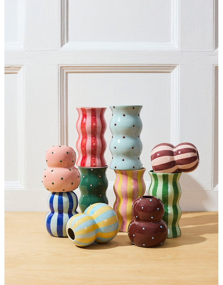 Jones & Co Palma Vase in blue and brown dotty design, showcasing a stylish ceramic vase with a rounded shape and dotted pattern.