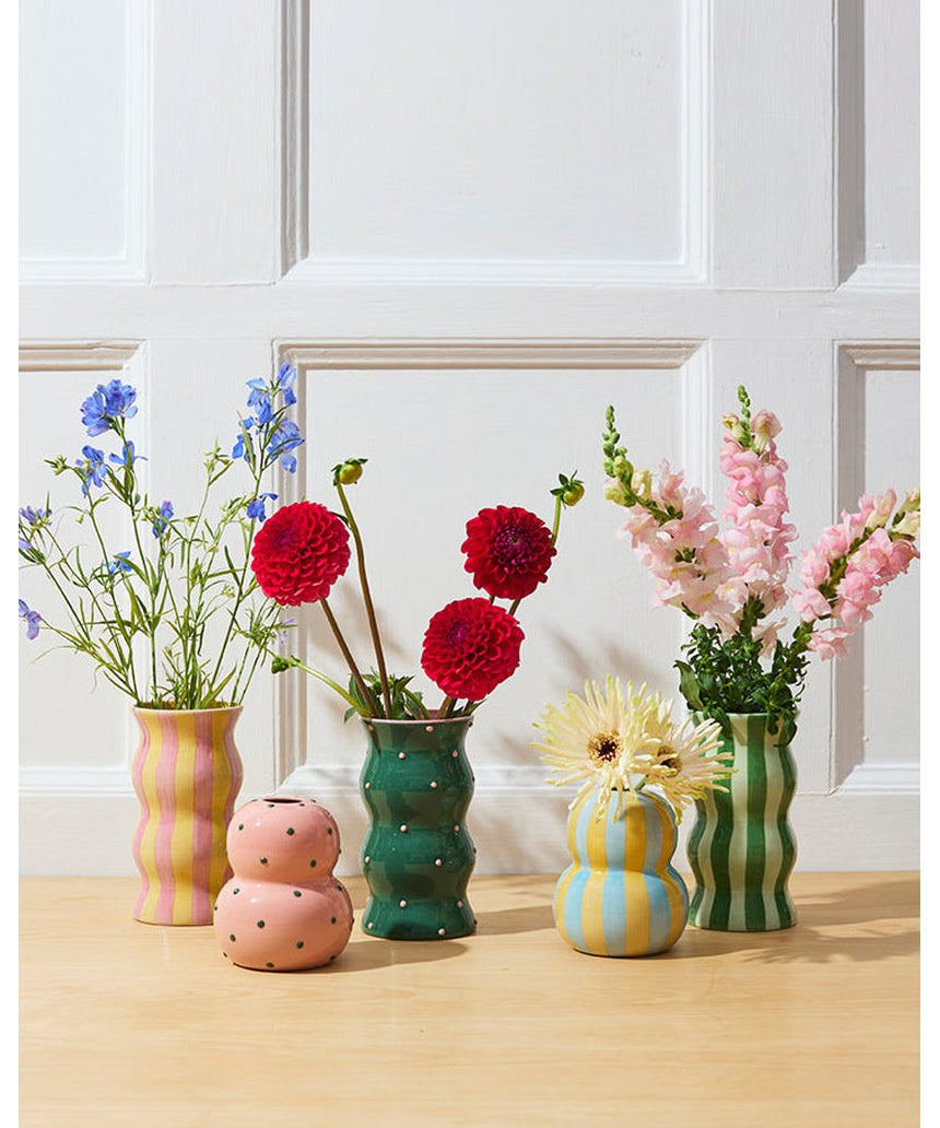 Jones & Co Palma Vase in green with pink dotty pattern, showcasing a stylish ceramic vase with a vibrant, playful design.