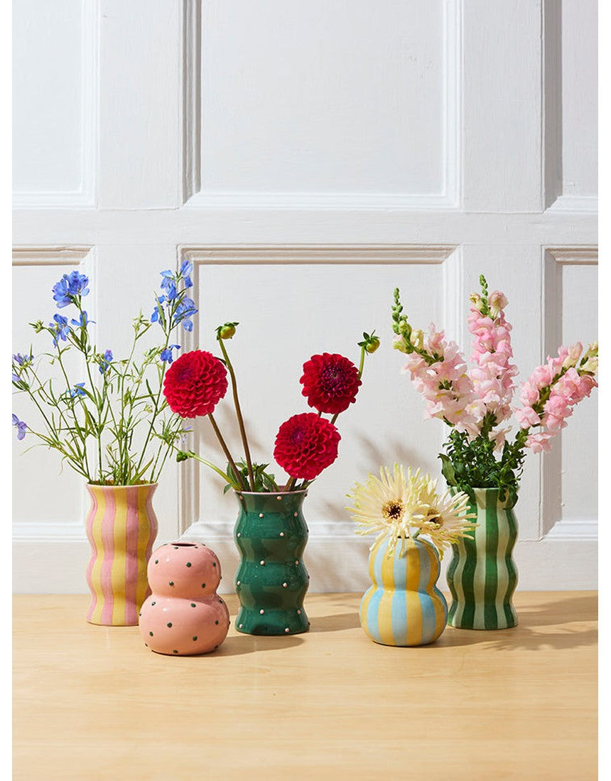Jones & Co Palma Vase in green with pink dotty pattern, showcasing a stylish ceramic vase with a vibrant, playful design.