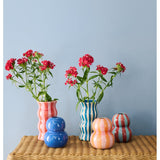 Jones & Co Palma Vase with red and pink striped design, showcasing a glossy ceramic finish and elegant shape.