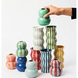 Jones & Co Palma Vase in red and pink stripe pattern, showcasing a stylish ceramic vase with colorful striped design.