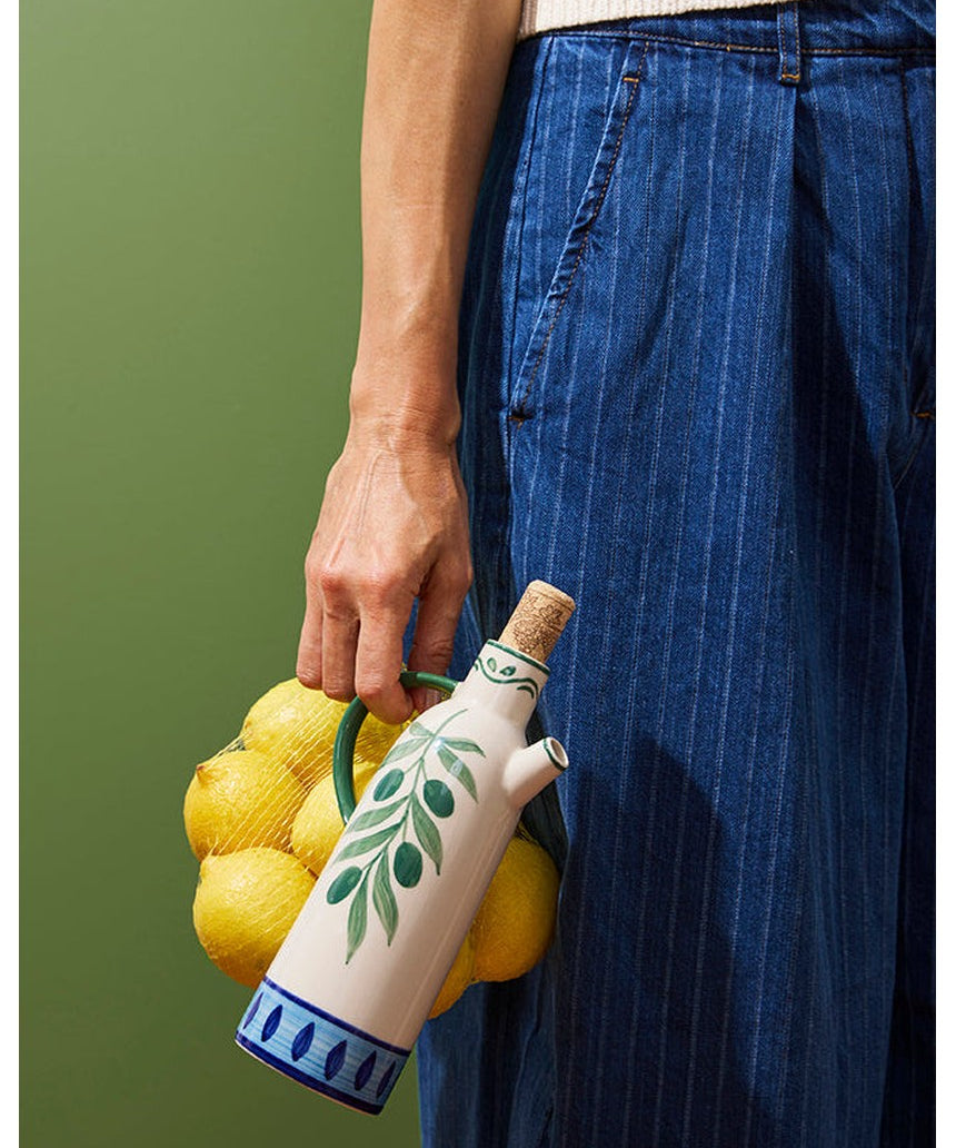 Jones & Co Piccolo Vita Oil Pourer, a sleek glass tableware oil dispenser with a stainless steel spout for easy pouring.