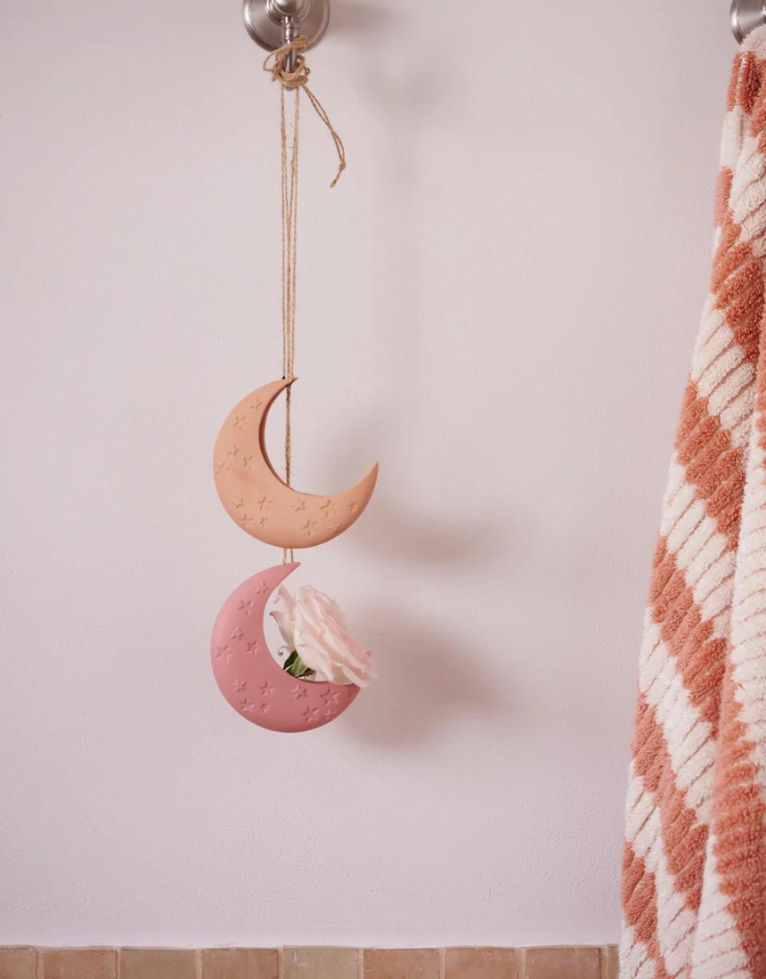 Jones & Co Luna Clay Hanging Vase showing a round, textured clay vase with a hanging rope detail.