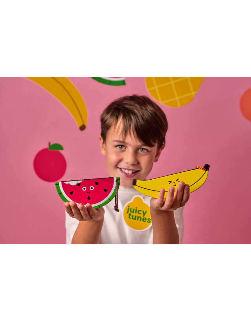 Wooden fruit harmonica by isAlbi, small colorful instrument for kids with fruit-shaped design and wooden construction.