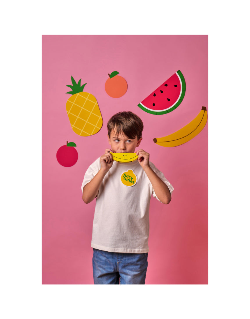 Wooden fruit harmonica by isAlbi, designed for kids, showing colorful wooden keys and playful fruit-themed decorations.