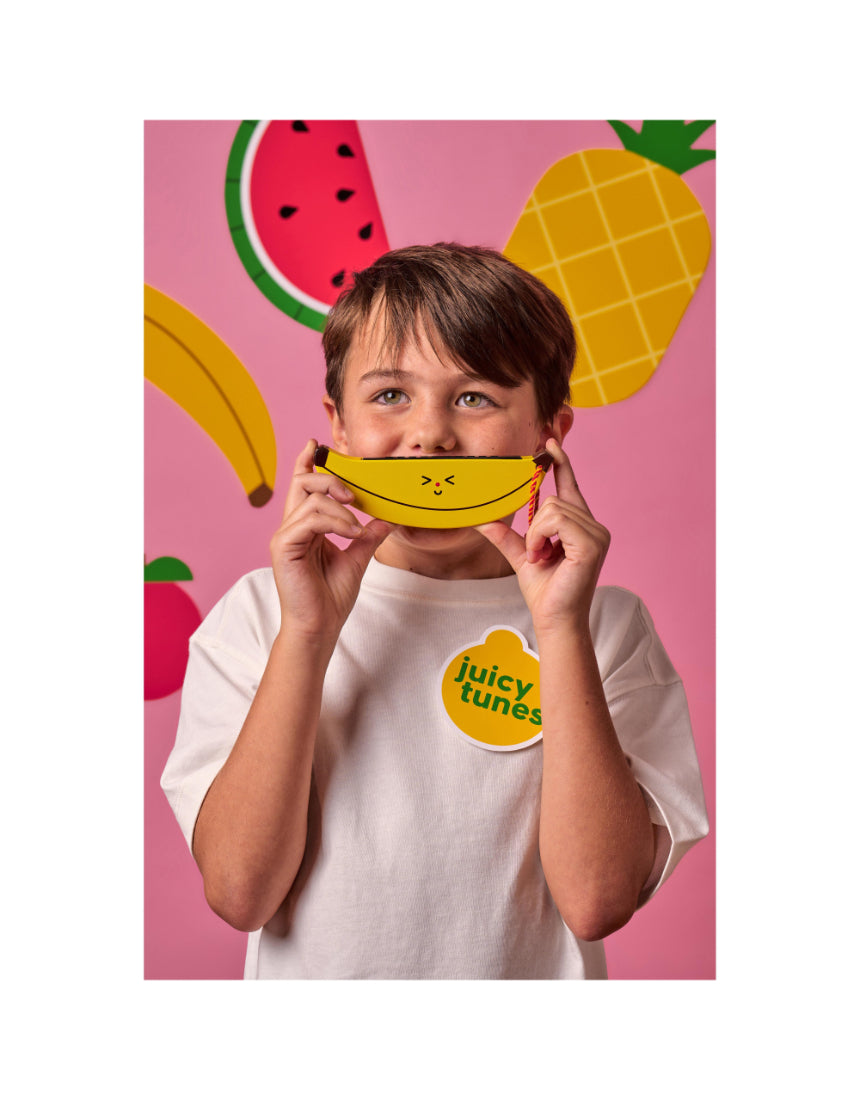 Wooden fruit harmonica by isAlbi, child-friendly musical instrument with colorful fruit-shaped design and wooden construction.