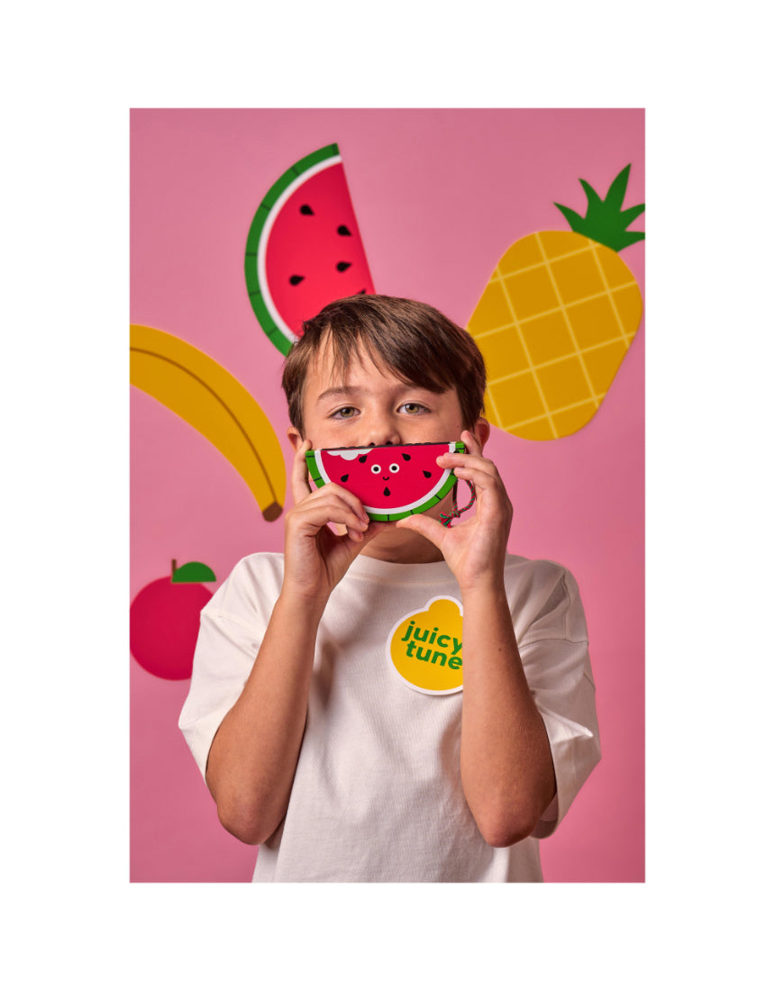 Kid playing wooden fruit harmonica by isAlbi, showcasing colorful fruit-shaped design and compact wooden construction.