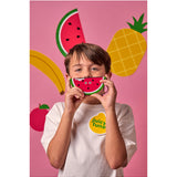 Kid playing wooden fruit harmonica by isAlbi, showcasing colorful fruit-shaped design and compact wooden construction.