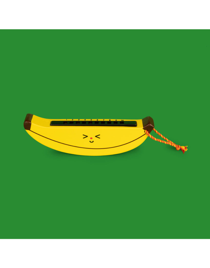 Wooden fruit harmonica for kids by isAlbi, showing colorful wooden fruit-shaped harmonica with a smiling child playing it.