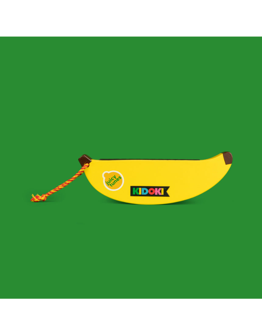 Kid playing isAlbi wooden fruit harmonica, a colorful educational musical instrument for children.