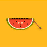 Wooden fruit harmonica by isAlbi, shown in a child's hand, featuring colorful fruit-shaped design and polished wooden surface.