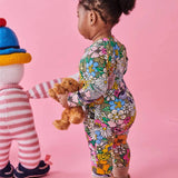 Kip & Co Bliss Floral organic long sleeve zip romper for babies, featuring colorful floral pattern and comfortable design.