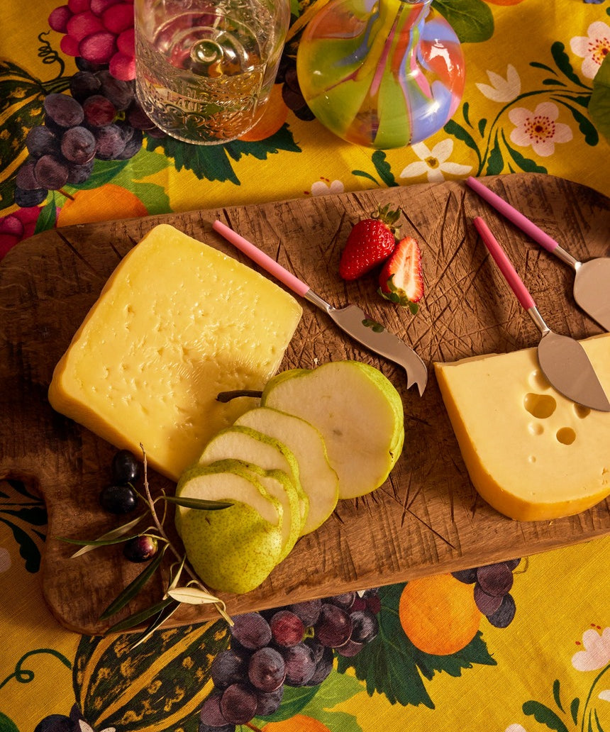 Kip&Co cheese knife set with colorful handles and stainless steel blades, perfect for serving cheese at gatherings.