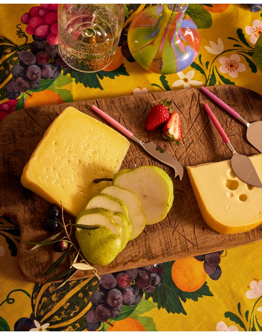 Kip&Co cheese knife set with colorful handles and stainless steel blades, perfect for serving cheese at gatherings.
