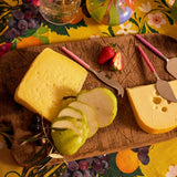 Kip&Co cheese knife set with colorful handles and stainless steel blades, perfect for serving cheese at gatherings.