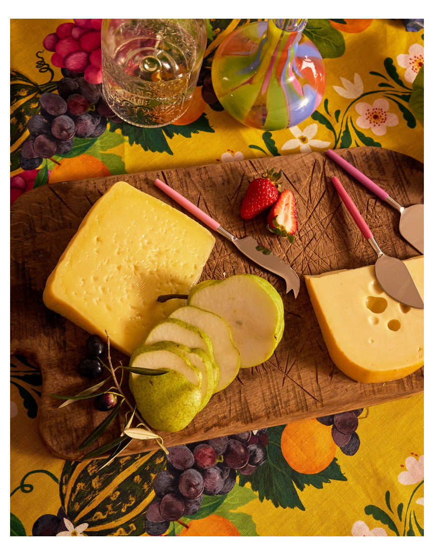 Kip & Co Diner Radiance cheese knife set with three stainless steel cutlery pieces on a wooden surface.
