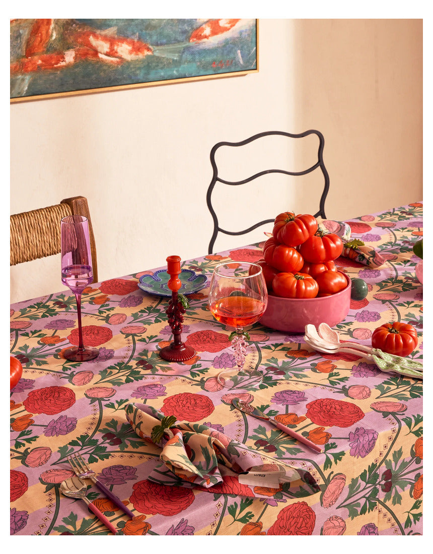 Kip & Co floral salad servers set with colorful, patterned cutlery for serving salads in a vibrant, decorative style.