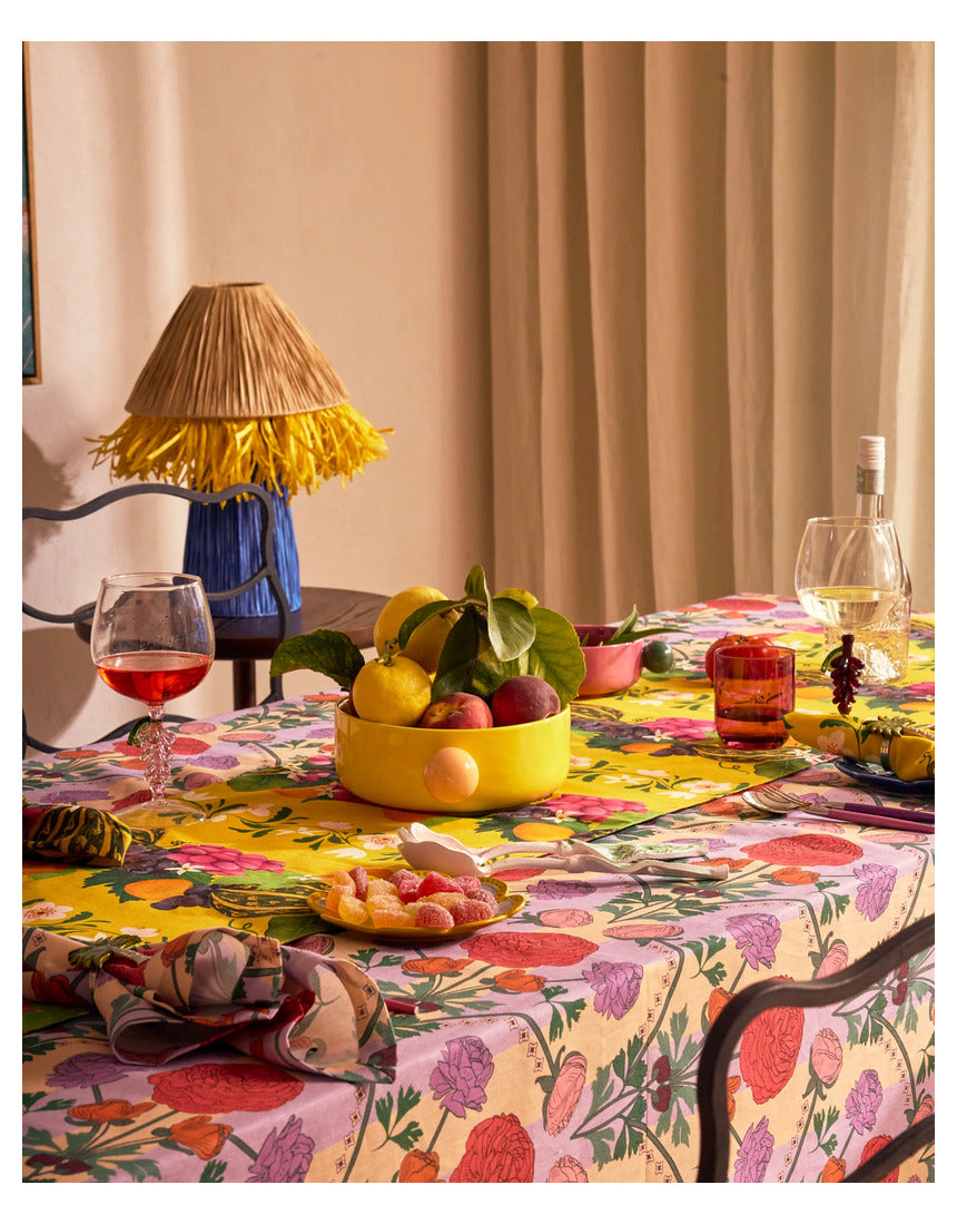 Kip & Co floral salad servers set with colorful, patterned handles and stainless steel prongs for serving salads.