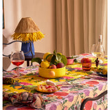 Kip & Co floral salad servers set with colorful, patterned handles and stainless steel prongs for serving salads.