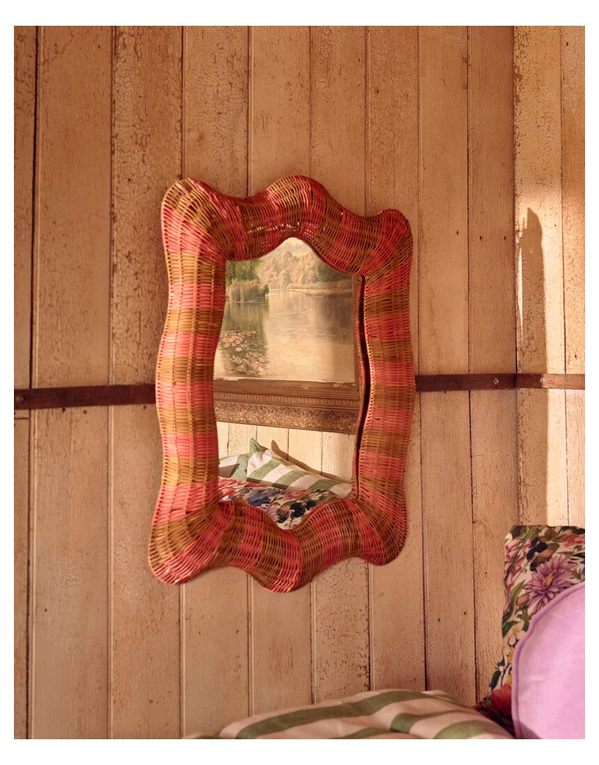 Kip & Co Guava Stripe Rattan Wall Mirror with a round rattan frame and vibrant striped design for stylish home decor.