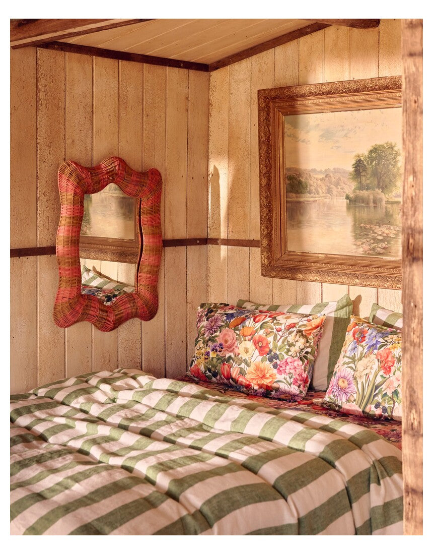 Kip & Co Guava Stripe Rattan Wall Mirror with round frame and woven rattan design, ideal for modern interior decor.