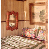 Kip & Co Guava Stripe Rattan Wall Mirror with round frame and woven rattan design, ideal for modern interior decor.