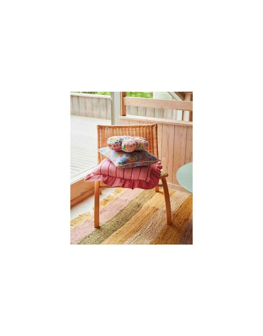 Kip & Co Iced Vovo stripe frill upholstery cushion with colorful striped fabric and ruffled edges on a soft cushion.